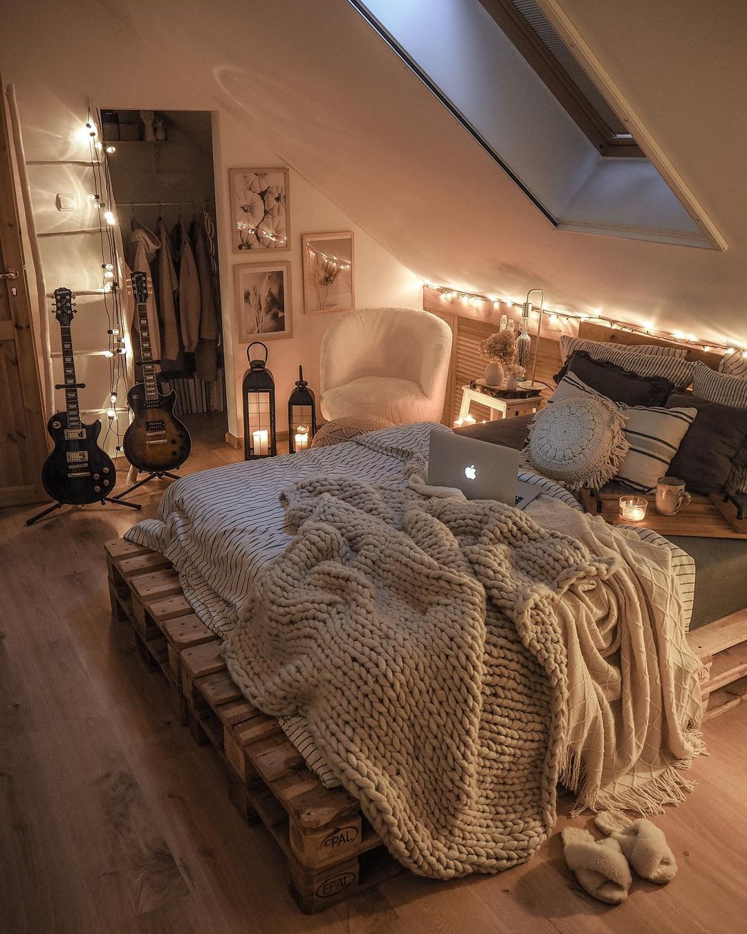 modern boho bedroom with pallet bed and fairy lights