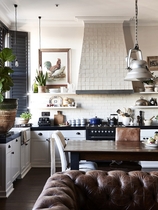 modern country white kitchen with white tiles on the splash back and ranger hood